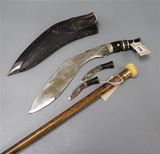 A malacca walking cane and a kukri knife in leather sheath Cane 89cm long